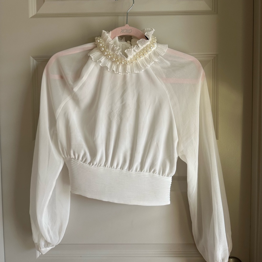 Sheer white blouse with Pearl detailing neckline